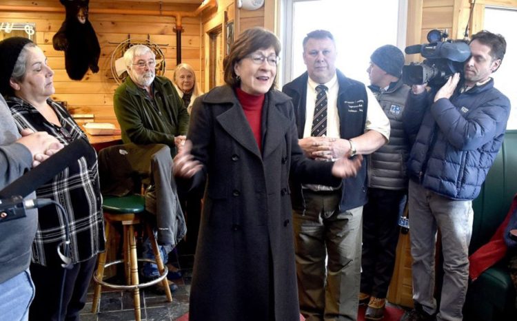 U.S. Sen. Susan Collins, R-Maine, visits with townspeople at Schmoose's Bar and Grill in Jackman on Thursday.