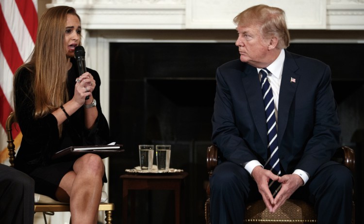 President Trump looks to Julia Cordover, the student body president at Marjory Stoneman Douglas High School in Parkland, Fla. Almost immediately after the Parkland shooting the president advocated arming some teachers.