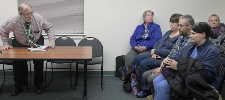 About 20 teachers and administrators of the Winthrop School Department attended a school board meeting on March 5 but had to wait outside, as much of the session was in executive session to discuss a personnel matter. Gary Rosenthal, left, superintendent of the district, was present for the meeting between the board and attorneys, as school workers continued to signal concern about the superintendent.