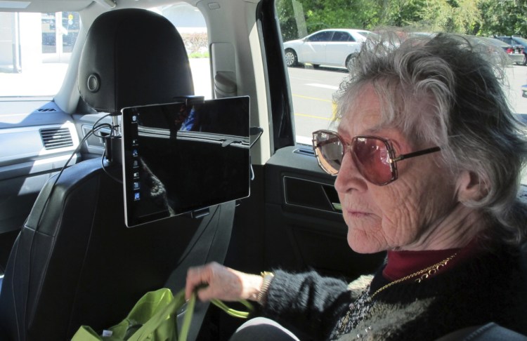 Sharon Van Etten, listening to a computerized voice in a vehicle equipped with software called "Atlas," which is meant to help the visually impaired interact with self-driving cars, participates in a University of Florida research project last month in Ocala, Fla.