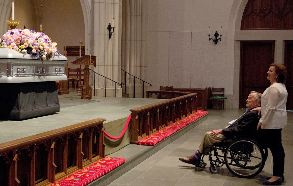 Former President George H. W. Bush looks at the casket of his wife former first lady Barbara Bush with his daughter Dorothy "Doro" Bush Koch at St. Martin's Episcopal Church Friday.