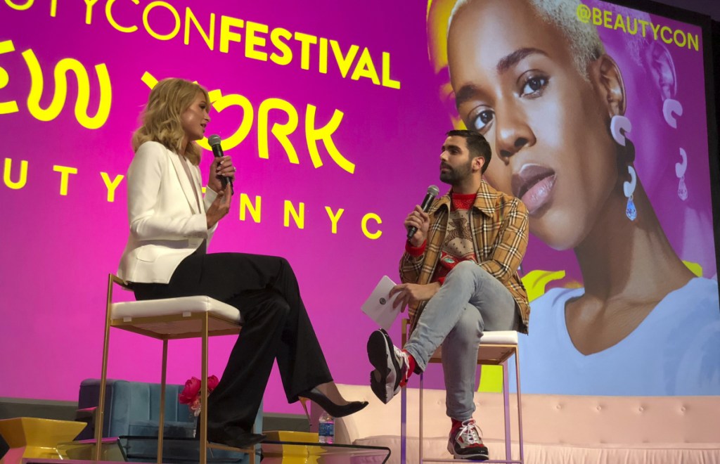 Paris Hilton, left, appears with moderator Phillip Picardi Saturday during the Beautycon Festival NYC.