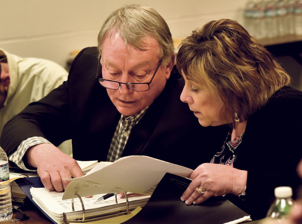 Superintendent Eric Haley discusses budget figures with school finance director Paula Pooler. A social worker was instrumental in helping with a recent abuse case, Haley says.