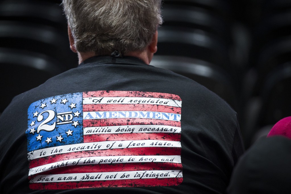 People in the audience wait for the start of the National Rifle Association-Institute for Legislative Action Leadership Forum at the Kay Bailey Hutchison Convention Center on Friday in Dallas.