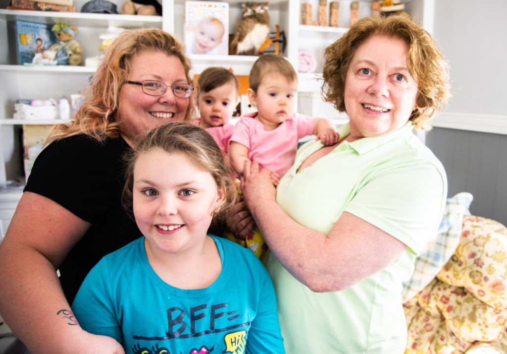 Lynn Merrill, far right, with her daughter Sarah Dyer and granddaughters Chloe Dyer, 8, and 10-month-old twins Charlie and Sadie Duplessis.