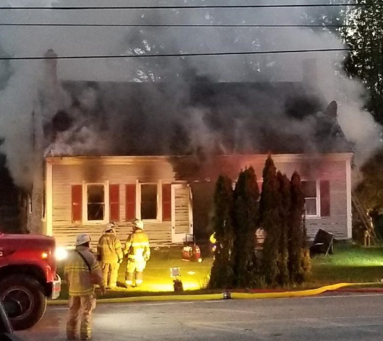 Smoke billows from the home at 114 Belgrade Road early Sunday.