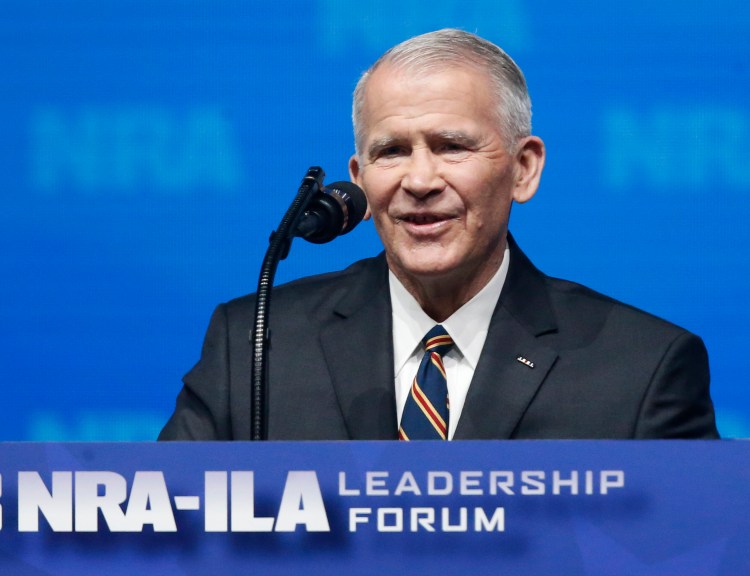 In this May 4, 2018 photo, former U.S. Marine Lt. Col. Oliver North speaks before giving the Invocation at the National Rifle Association-Institute for Legislative Action Leadership Forum in Dallas. The NRA announced today that North will become President of the National Rifle Association of America.