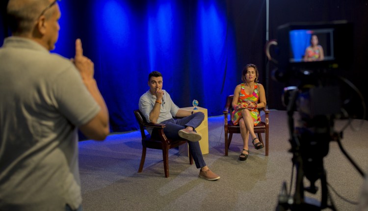 Tom Handel, left, shows Mateo Hodo and Julia Trujillo Luengo how he will count down before beginning to record Trujillo's new community television show, "Global Connections." The show is one of Trujillo's new programs as director of Portland's Office of Economic Opportunity. She she has been laying the groundwork for efforts to better integrate new Mainers into the economy and community.