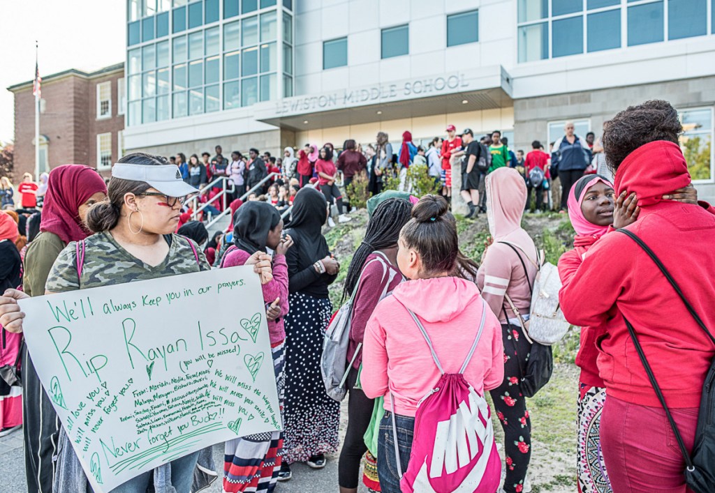 Kaylani Castillo holds a sign at a Wednesday display at Lewiston Middle School remembering her classmate, Rayan Issa,who drowned Tuesday at Range Pond State Park in Poland while on a school field trip.
Photo by Andree Kehn/Sun Journal