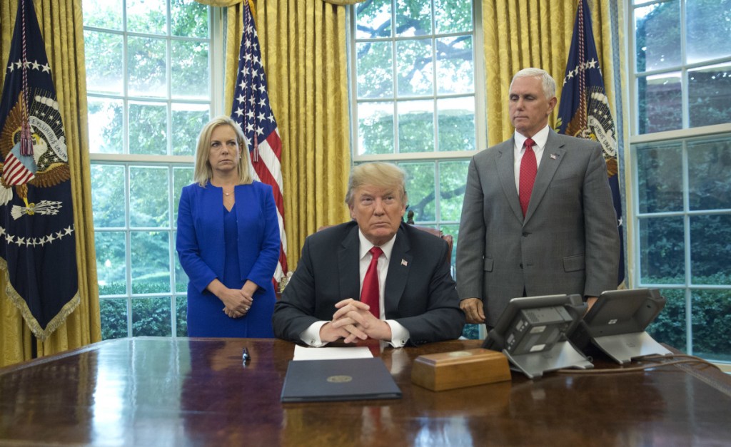 President Trump, with Homeland Security Secretary Kirstjen Nielsen and Vice President Mike Pence, before signing an executive order Wednesday to end family separations at the border.