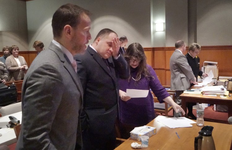 Anthony Sanborn Jr., center, reacts Nov. 8 after learning his 27 years in prison were ending. Sanborn writes that as far as he knows, Attorney General Janet Mills has done nothing to correct his wrongful prosecution.