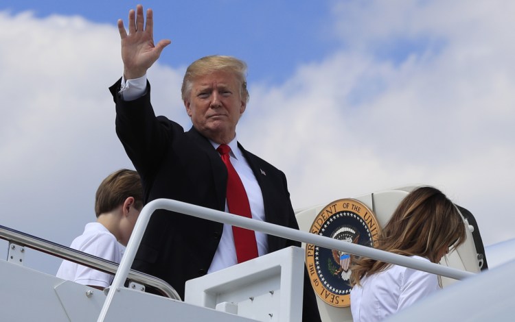 President Trump boards Air Force One at Andrews Air Force Base, Md., on Friday for a trip to his golf club in Bedminster, N.J.