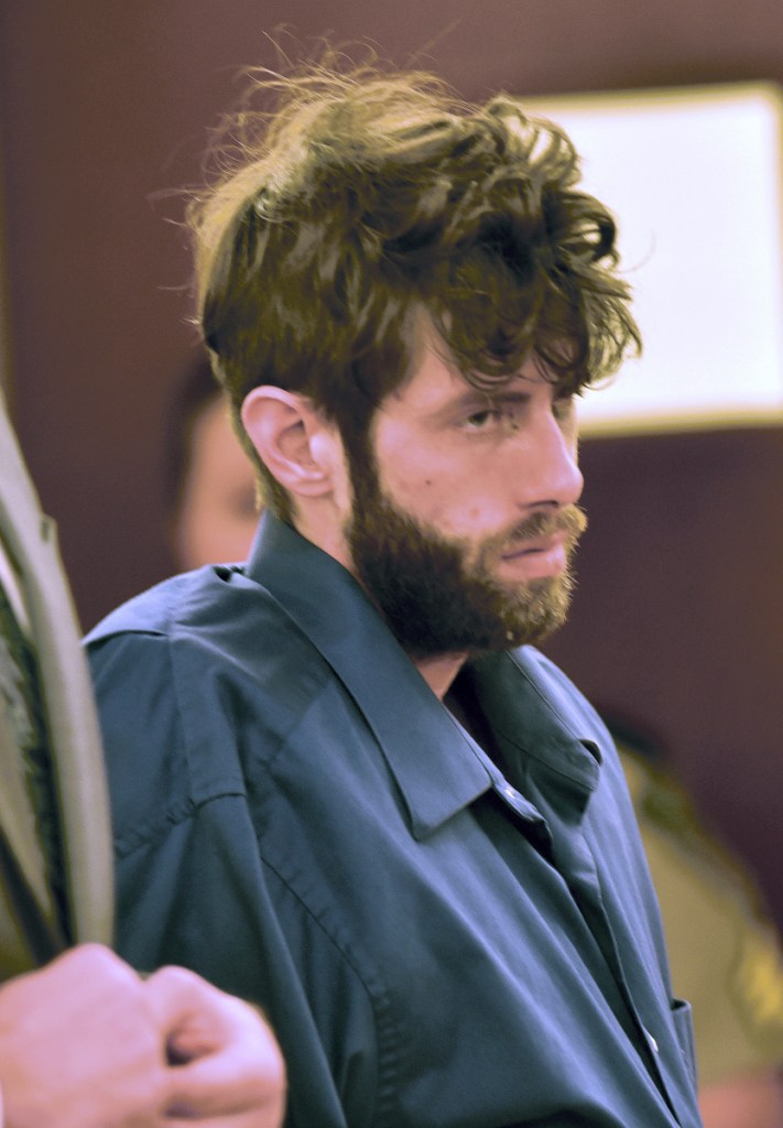 Defendant John D. Williams listens during a hearing at Capital Judicial Center in Augusta on April 30. Williams is charged with murder in the death of Somerset County Deputy Cpl. Eugene Cole on April 25.