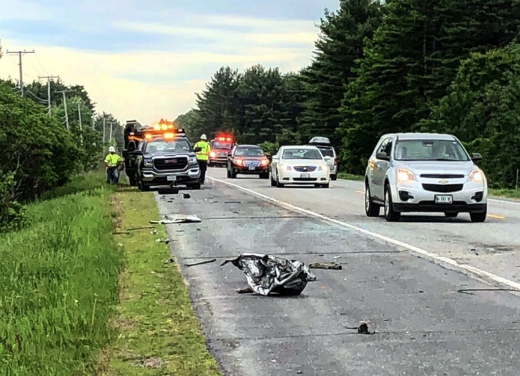 Shattered glass and debris from a 2002 Buick LeSabre are scattered on the side of Skowhegan Road as vehicles pass by the scene of a two-vehicle collision Friday morning in Fairfield. The LeSabre's owner, John Hamlin, 64, of Cornville, was driving toward Fairfield when police say he got a flat tire, causing him to cross the center line and strike the tractor-trailer.