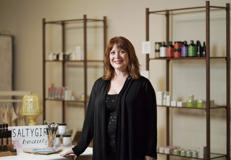 Sarah Kelly poses for a photo at the Biddeford office of SaltyGirl Beauty, an all-natural cosmetics business that she was inspired to start after her experience with breast cancer and her early work with Tom's of Maine.
Photographed on Tuesday, June 26, 2018. (/Staff Photographer)