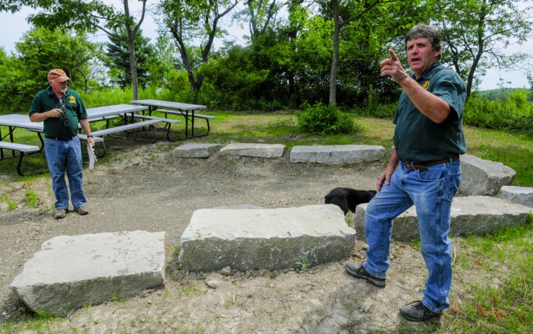 Youth Program Coordinator Mark Goodridge, left, and Executive Director David Trahan give a tour of the new Sportsman's Alliance of Maine outdoor activity area, which is currently undergoing development in Augusta.