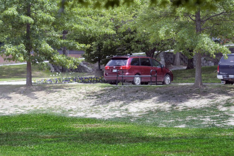 The nongrassy knoll at City Center in Augusta is seen Tuesday. It's one of several areas of Augusta that have been left barren by grubs.