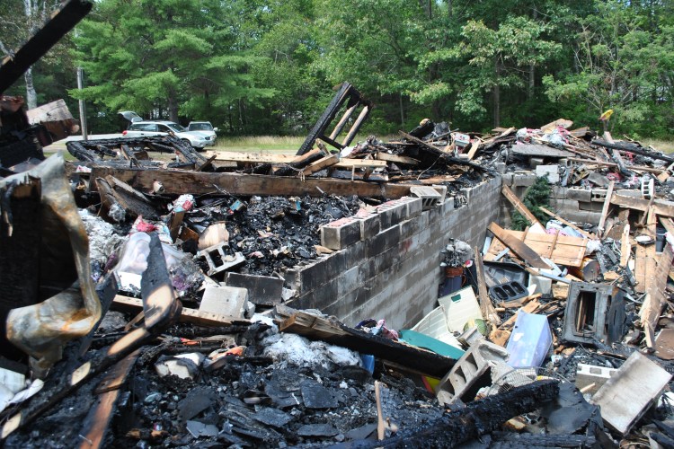 A fire in a house on Wakefield Road in Hollis on Sunday, July 15, 2018, destroyed the home and displaced a family of four.