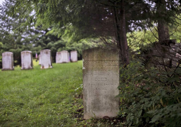 Pedro Tovookan Parris' gravestone sits off to the side in a private graveyard where the rest of the Parris family is also buried. He died at 27 of pneumonia. 