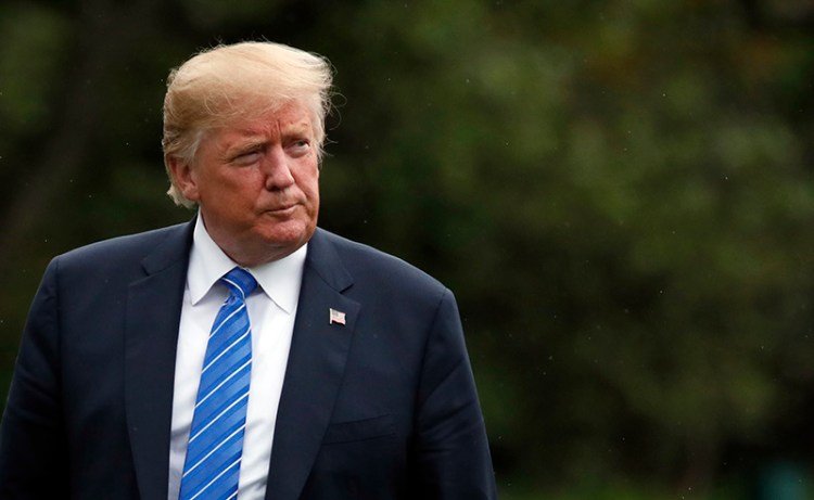 President Donald Trump walks on the South Lawn after stepping off Marine One at the White House, Tuesday, July 24, 2018, in Washington. Trump is returning from a trip to Kansas City, Mo. (AP Photo/Alex Brandon)