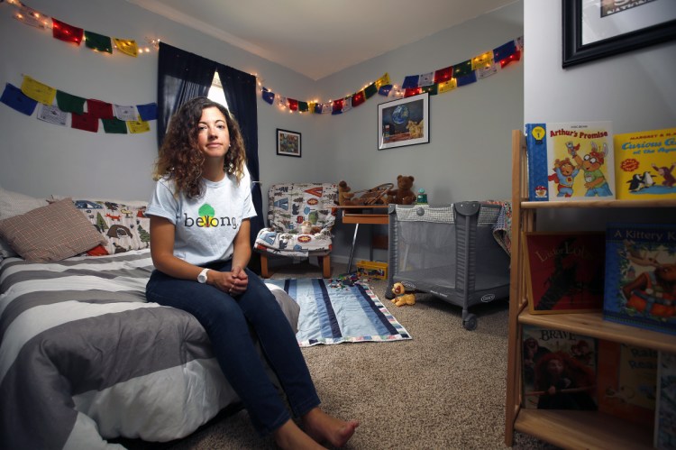 Stefanie Millette sits in the room she uses for the children she has taken into her Freeport home as a foster parent. 