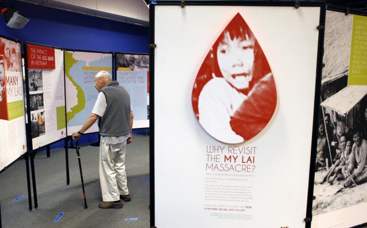 Charles Hedrick, of Nobleboro, takes in the Veterans for Peace My Lai Memorial at Portland Media Center on Saturday. Hedrick, who served in the Navy and Naval Reserve during peace-time years between the wars in Korea and Vietnam, said the exhibit was powerful. “It’s incredible,” he said. “This is something we should never forget.” 