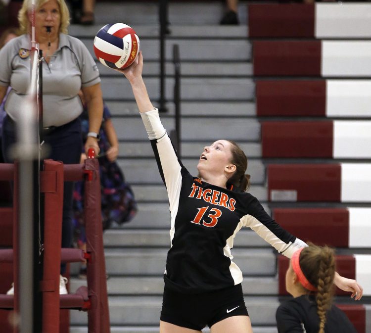 Biddeford's Brooke Reissfelder spikes the ball on Thursday during a match against Greely.