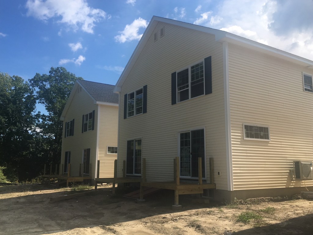 The duplexes have private decks at the back.