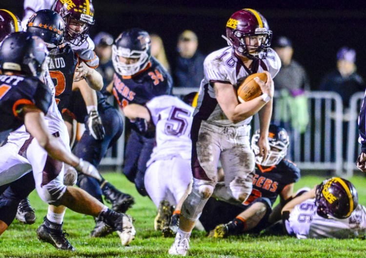 Cape Elizabeth's Garrett Mello runs the ball against Gardiner during a game Friday at Hoch Field in Gardiner.