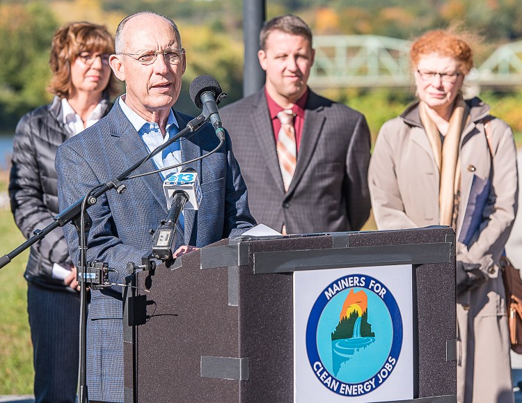 Peter Vigue, CEO of Cianbro, speaks about the environmental benefits of the New England Clean Energy Connect Project during a news conference in Lewiston on Tuesday. Behind him are Tawnya Brown, from Associated Builders and Contractors, Lewiston Mayor Shane Bouchard, and Lewiston Auburn Chamber of Commerce President Rebecca Swanson. The project has faced opposition from public groups. 