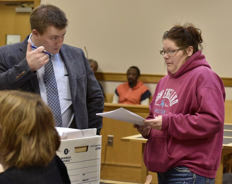 Assistant District Attorney Frank Griffin speaks with defendant Jaime Danforth before a hearing Wednesday in Somerset County District Court in Skowhegan. Danforth has been charged with animal trespass after her Holstein cow wandered on to a neighbor's property, where it was shot. The case may go to trial next spring.