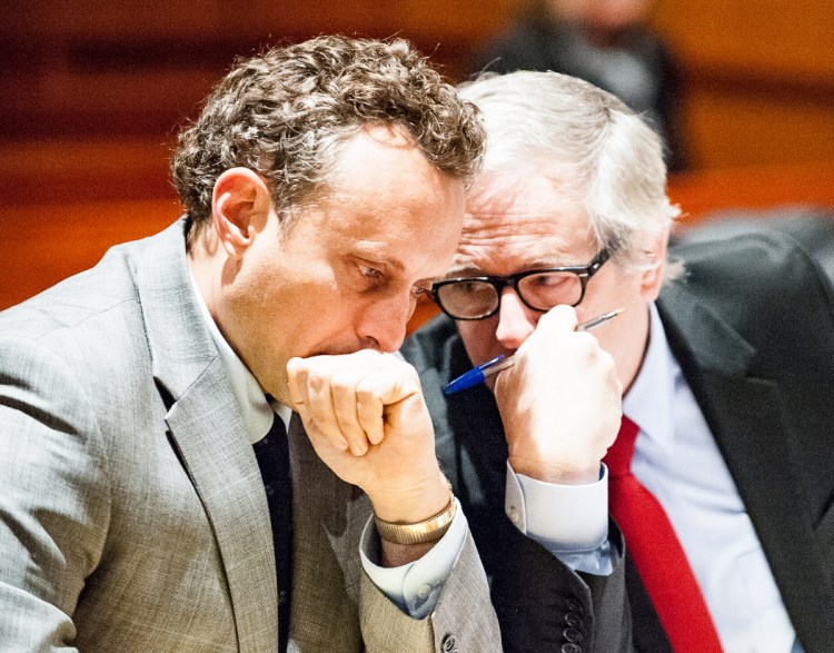 Lewiston attorney James Howaniec, right, speaks with his client, suspended lawyer Seth Carey, on Wednesday morning in Cumberland County Superior Court in Portland during Carey's sanctions hearing.