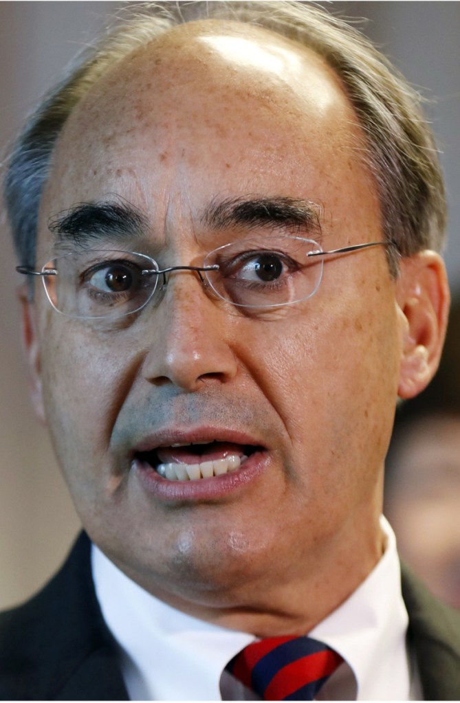 FILE - This combination of photos show U.S. Rep. Bruce Poliquin in 2017, left, and state Rep. Jared Golden in 2018, right, in Maine. Golden is challenging Poliquin for the 2nd District Congressional seat in the November 2018 general election. The battle over who will represent Maine in the largest congressional district east of the Mississippi River is the most expensive political race in state history. (AP Photos/Robert F. Bukaty, File)