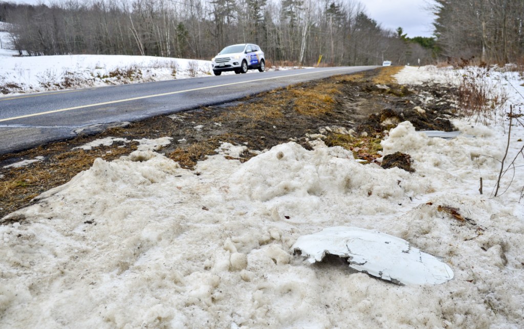 Vehicle parts remain at an accident scene Thursday on Route 3 near Lake St. George State Park in Liberty.