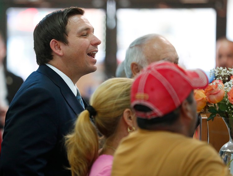 Ron DeSantis, left,  in Hialeah Gardens, Fla. on Nov. 8. 