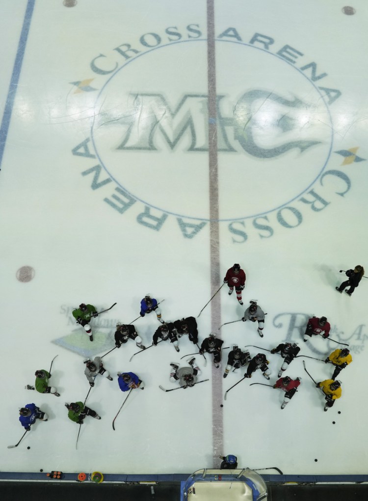 Caitlin Jordan, at bottom, and her Scarborough High girls' hockey players may still practice at various rinks, but they know their home games this season will be in Gorham at the University of Southern Maine. After two years, home sweet home.