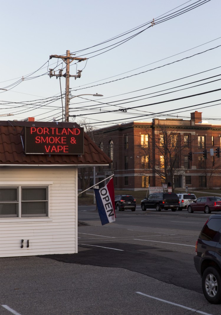 At 585 Broadway, Portland Smoke & Vape operates in sight of Mahoney Middle School. The proximity of the vape shop concerns residents and city officials who feel it sends the wrong message to students.