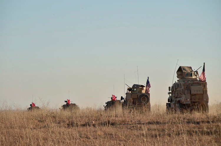 U.S. troops and Turkish troops conduct joint patrols around the Syrian town of Manbij in November.