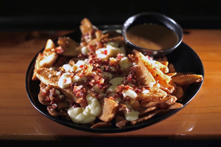 Bacon Poutine is an example of a dish of mixed provenance that's above average.