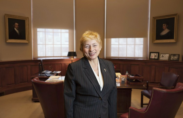 Gov. Janet Mills poses last week in her office at the State Capitol Building in Augusta, where she offered thoughts about the opioid epidemic that has gripped the state for years. "I'm just tired of talking about it," she says, after serving on two separate task forces. "I really just want to take action."