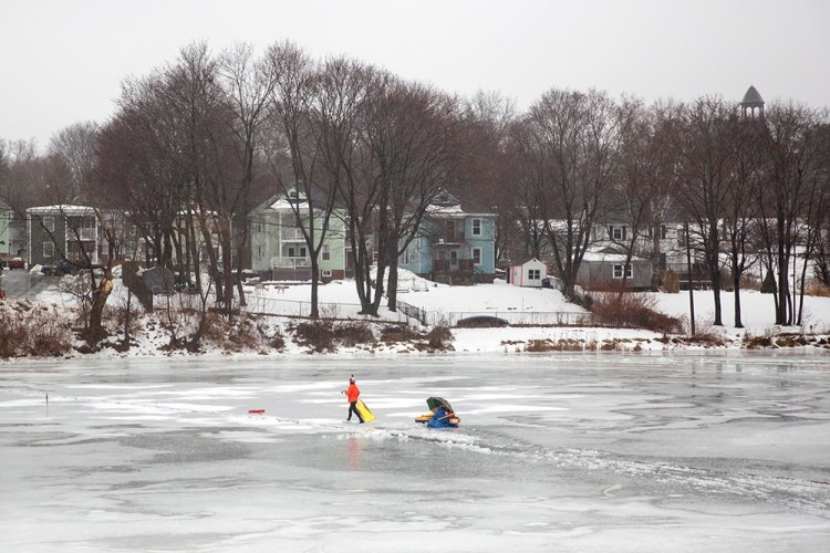 Chris Angelo works on the Westbrook ice disk on Thursday.