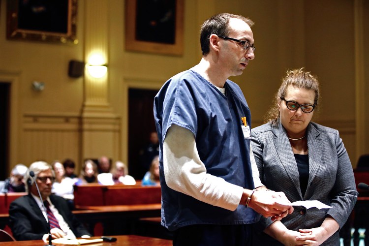 Derek Boyce, a former teacher, reads a statement after pleading guilty to several counts of sexual misconduct with a 15-year-old student, in Androscoggin County Superior Court in Auburn on Wednesday. At right is his lawyer Heidi Pushard.