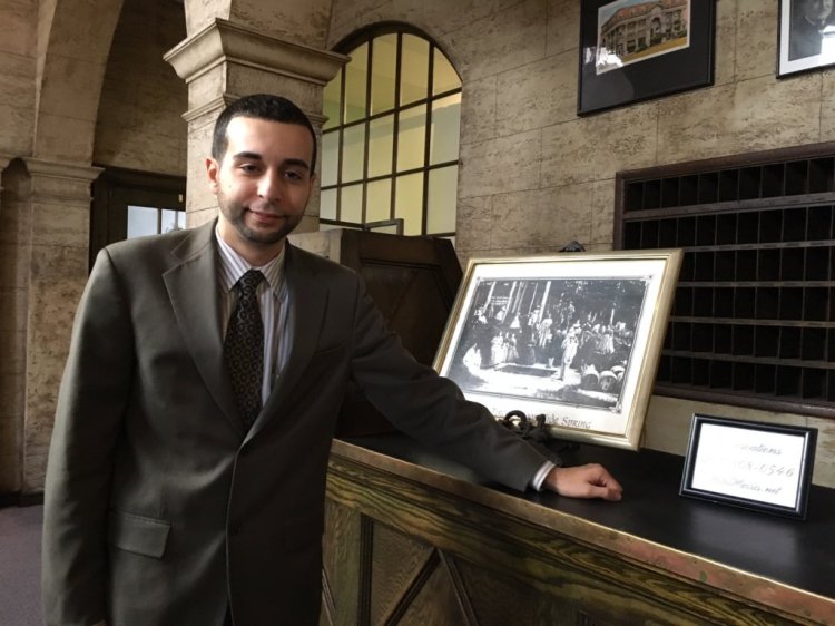 Jim Adinolfi, marketing director and owner of Jadin Hotels, stands in the lobby of the Hotel Harris building in Rumford. Adinolfi handles marketing for the three rooms in the building on 25 Hartford St. that he says he offers to guests. 