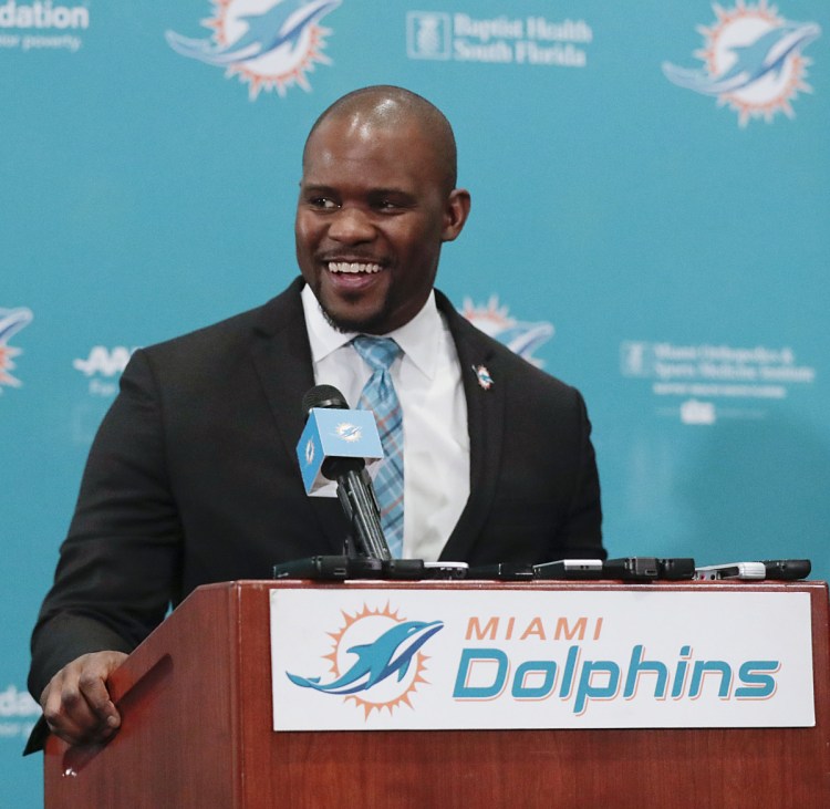 Brian Flores helped the New England Patriots win the Super Bowl on Sunday and was introduced as the Dolphins head coach on Monday.