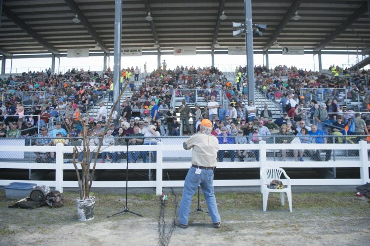 Robert Lambert welcomes the crowd on June 9 to the moose call demonstration at the Skowhegan Moose Fest at the Skowhegan Fairgrounds. A Guinness World Record was set by the 1,054 people who simultaneously made moose calls.