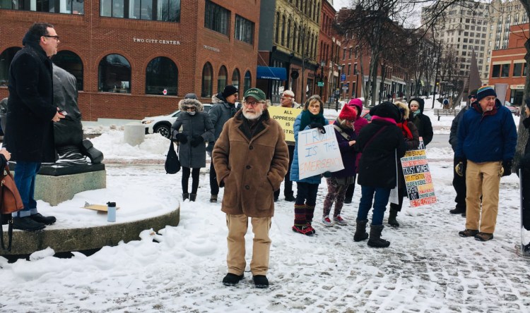 State Rep. Michael A. Sylvester addresses protesters assembling at Portland's Menario Plaza on Monday. Rallies against President Trump's declaration of a national emergency were held across Maine and nationwide.