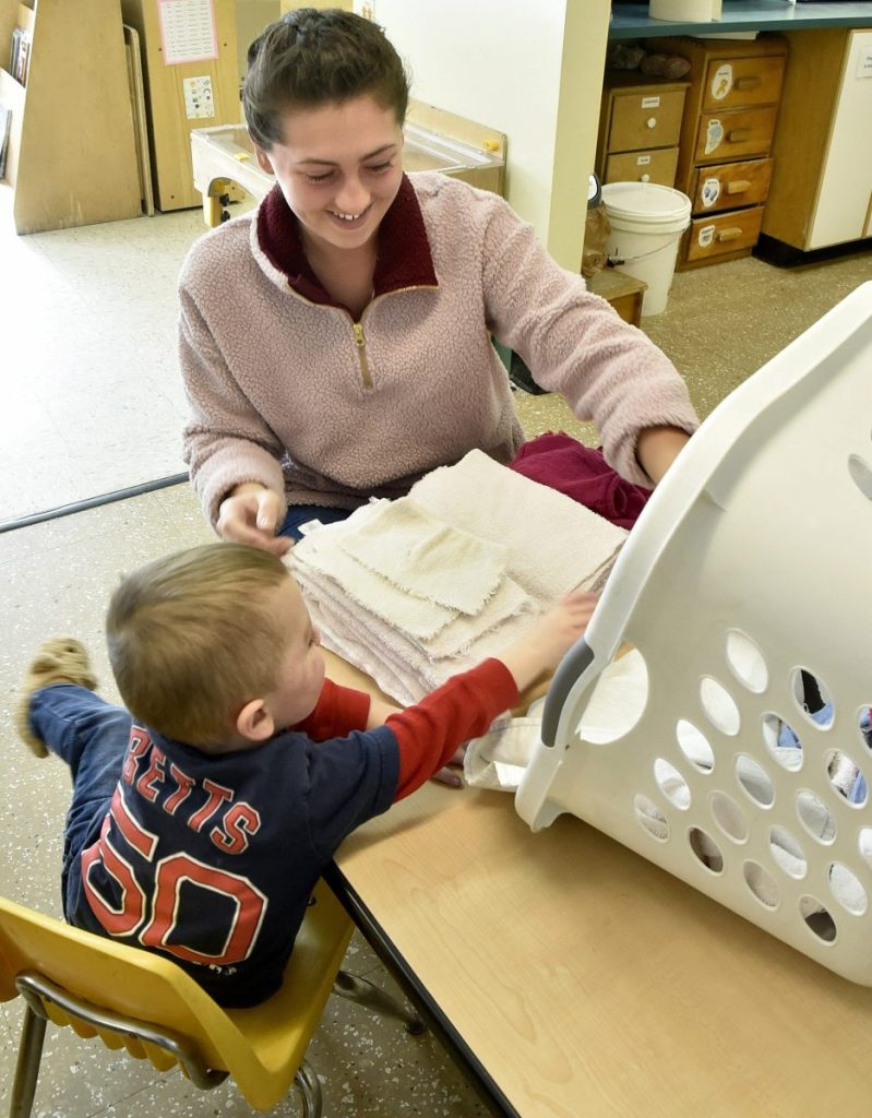 University of Maine at Farmington student Lexi Lettre works with a young boy named Andrew at the Sweatt-Winter Child Care and Early Education Center on Tuesday morning. The on-campus program will be moving into another nearby building by the end of summer.