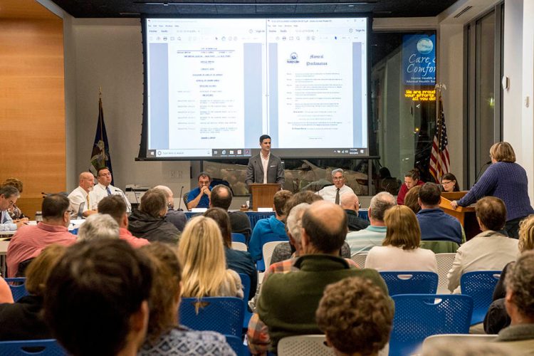 Mayor Nick Isgro presides as the Waterville City Council meets in the Chace Community Forum in the new Colby College dorm downtown on Oct. 2. Some residents want the venue for council meetings changed because Colby policy prohibits guns.