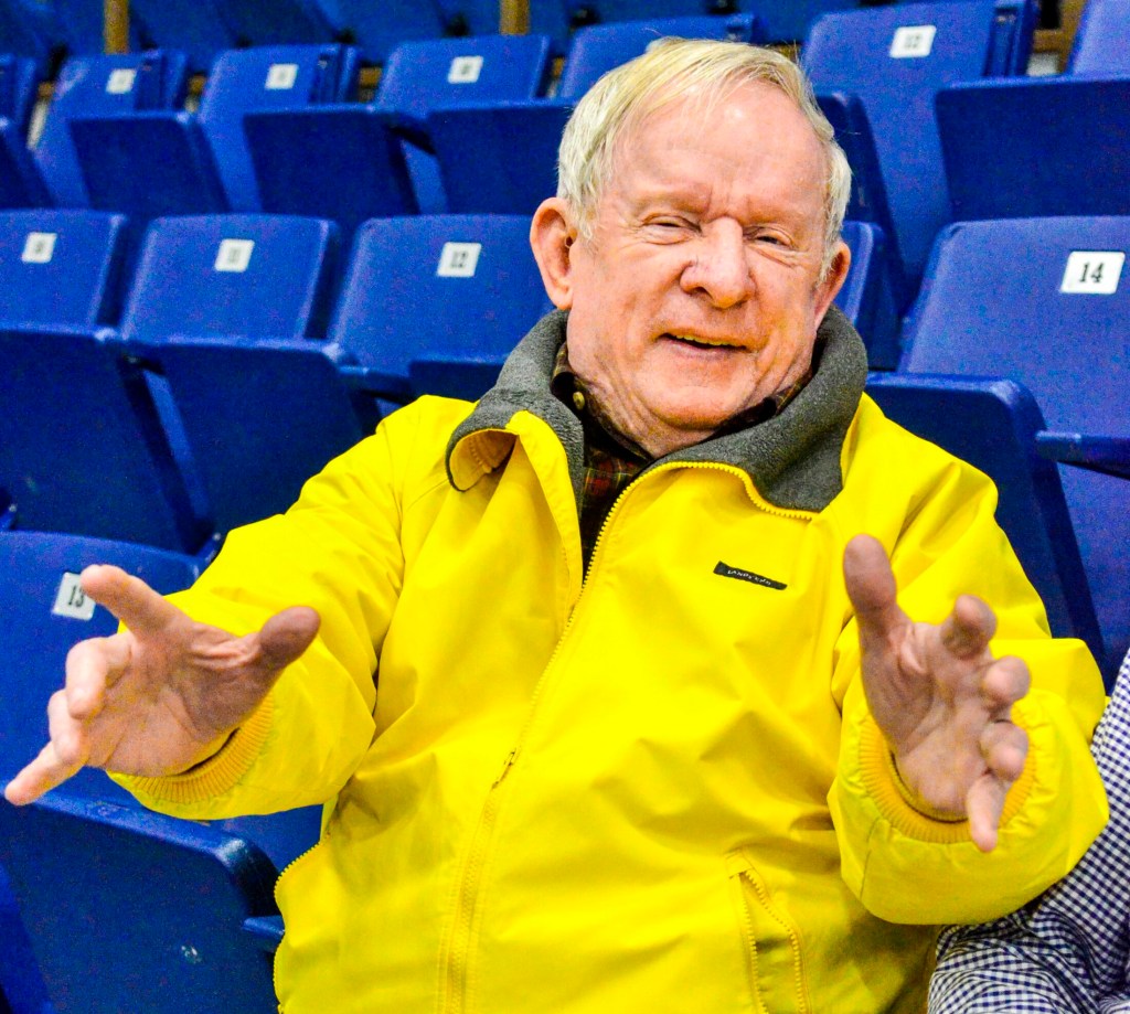 Basketball fan and former coach Ed Coffin sits in his newly dedicated chair Thursday at the Augusta Civic Center.