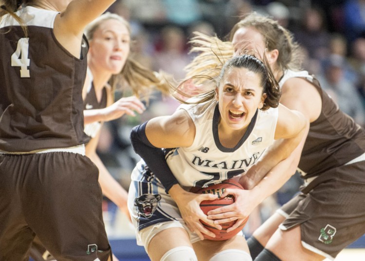 BANGOR,  ME - DECEMBER 8, 2018 
 University of Maine's Blanca Millan (22) battles for the ball with Brown University's with Brown University's Erika Steve (31) at the Cross Insurance Center in Bangor on Saturday, Dec. 8, 2018. Maine defeated Brown 102-96 in overtime advancing to 7-2 on the season.  (Staff Photo by Michael G. Seamans/Staff Photographer)